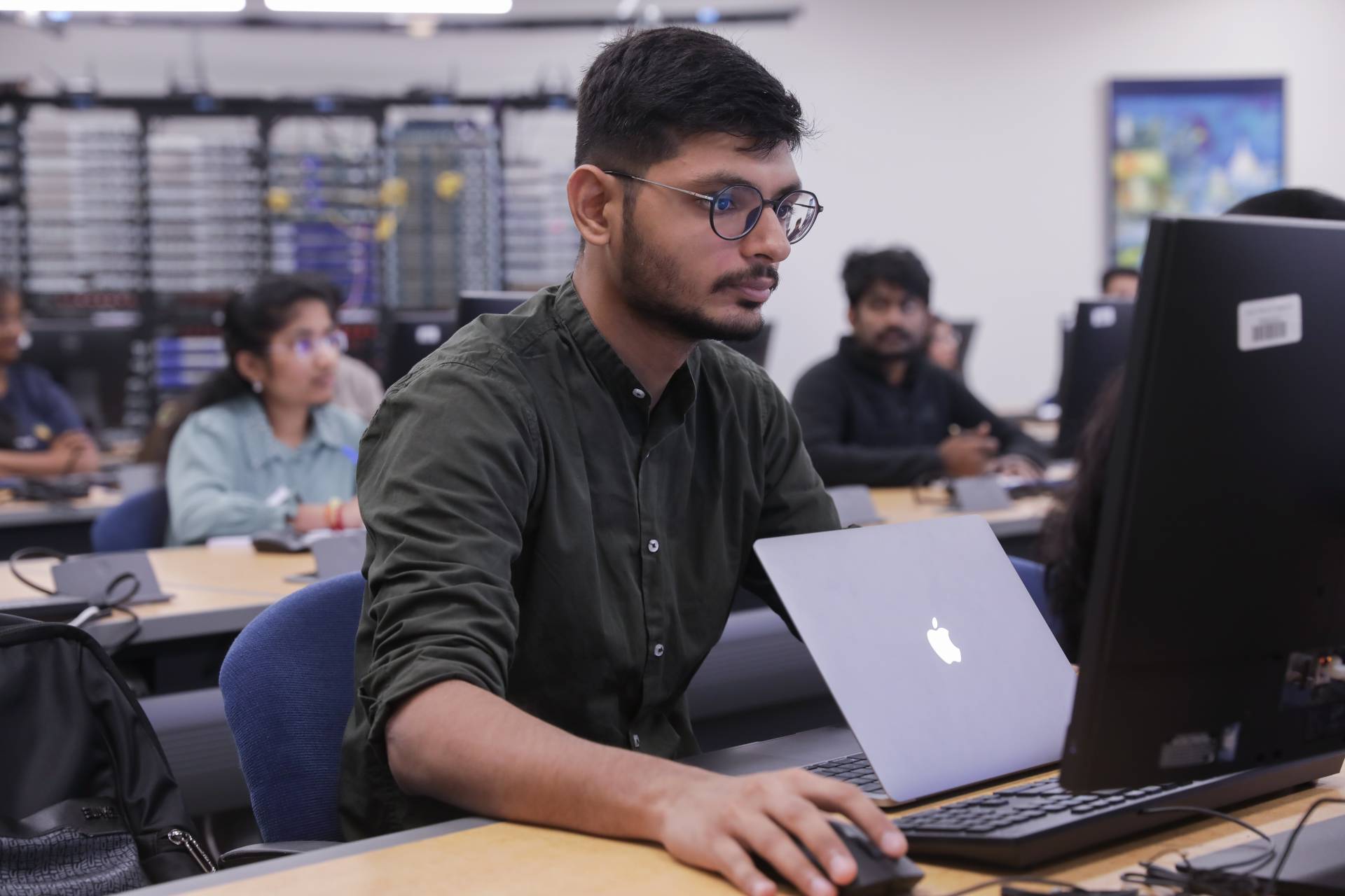 Photo of College of Business student working at a computer