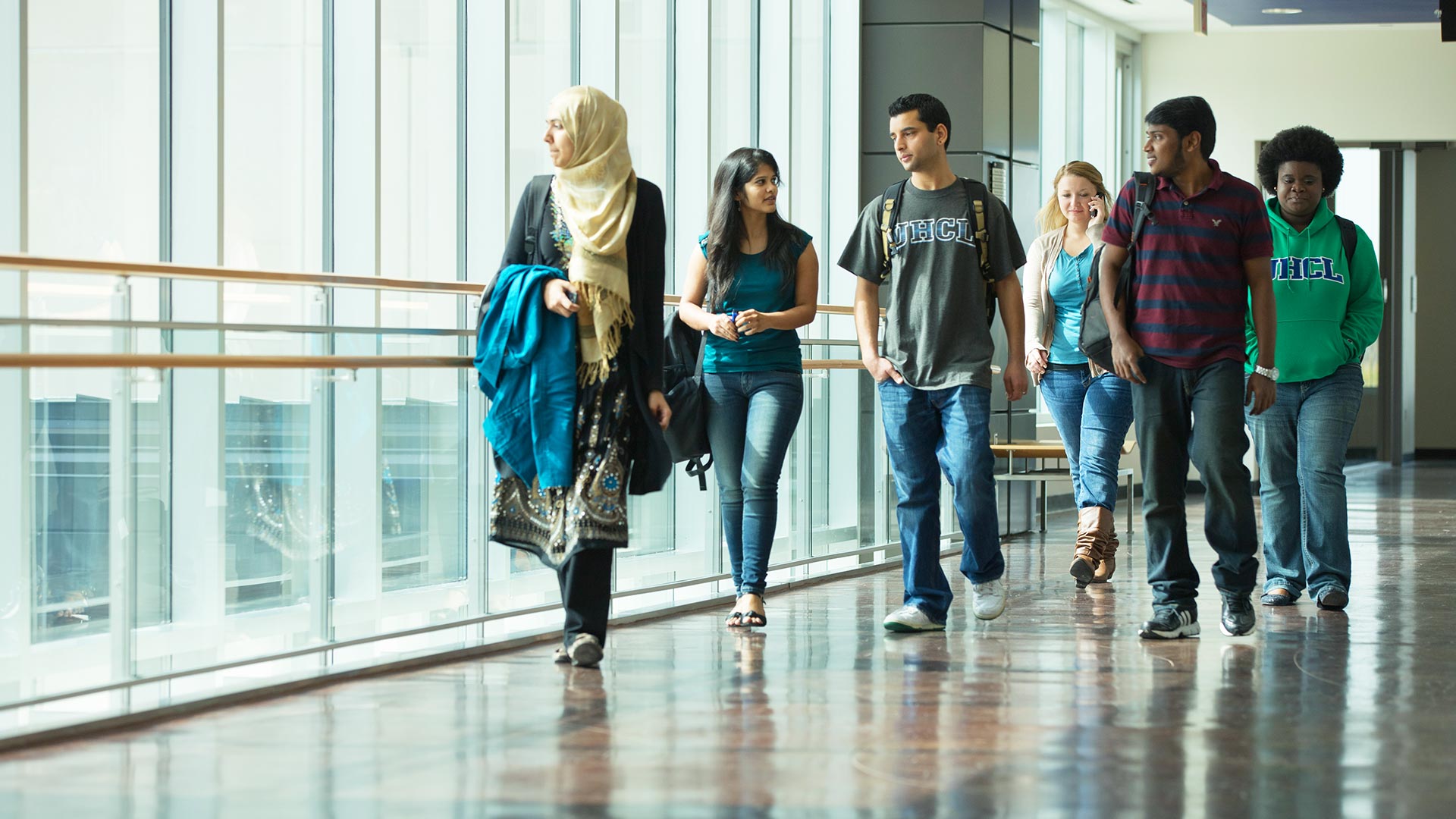Photo of prospective UHCL students touring inside of campus building