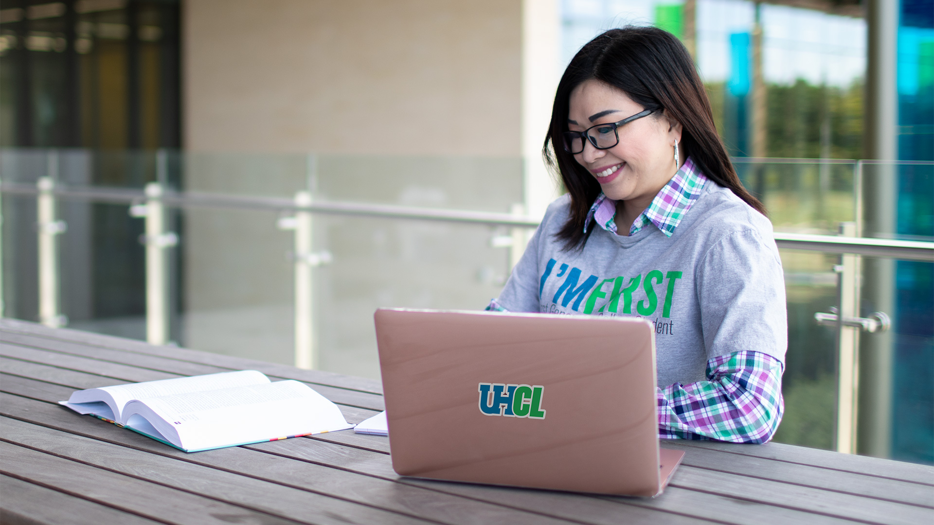 Photo of UHCL student sitting at laptop