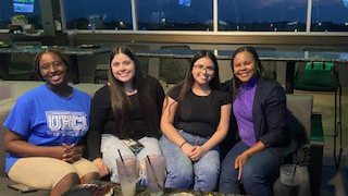 Photo of a group of UHCL students at Top Golf