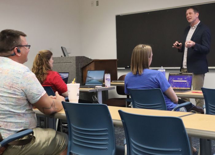 Image of Dr. Rolf in front of a class.