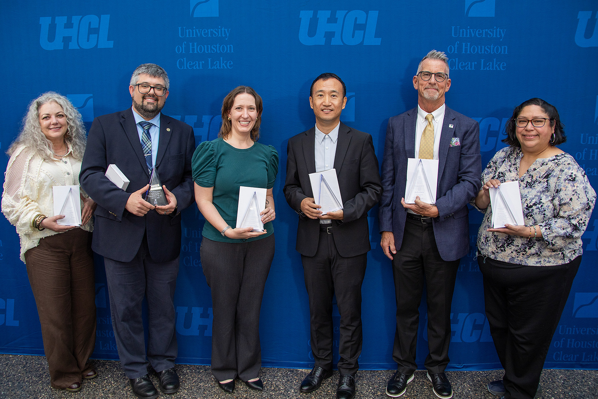 Group faculty award photo including Dr. Christine Walther