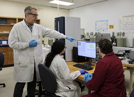 Dr. Michael LaMontagne demonstrates how the MALDI-TOF spectrometer is used
